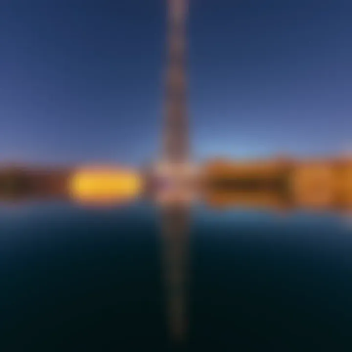 Burj Khalifa Reflection During Water Show The Burj Khalifa reflecting on the lake as the water show begins.