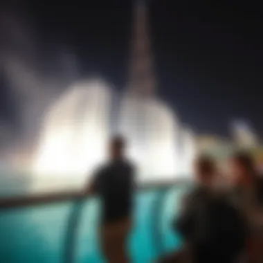 Visitors Enjoying the Water Show Visitors enjoying the mesmerizing Burj Khalifa Water Show from the promenade.
