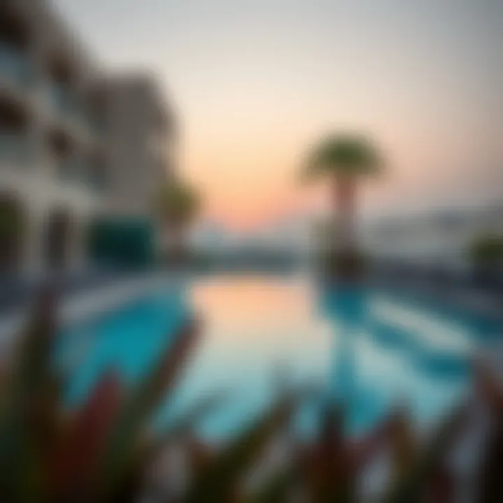 Outdoor pool and relaxation area at Staybridge Suites Dubai Internet City